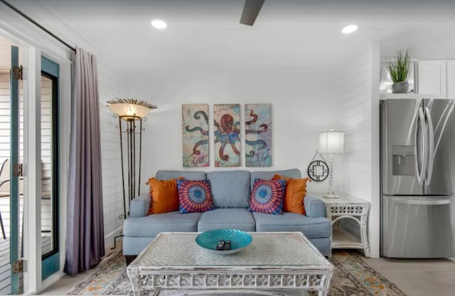 living area featuring plenty of natural light and recessed lighting