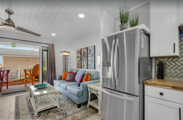 living area featuring recessed lighting, wood ceiling, and ceiling fan