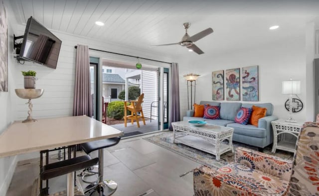 living area featuring wooden ceiling, a ceiling fan, and recessed lighting