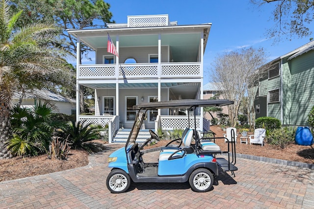 view of front of property with a balcony and a porch