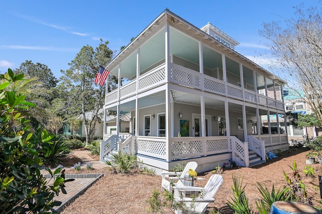 view of front of home with a porch and a balcony