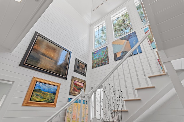 stairs featuring a high ceiling