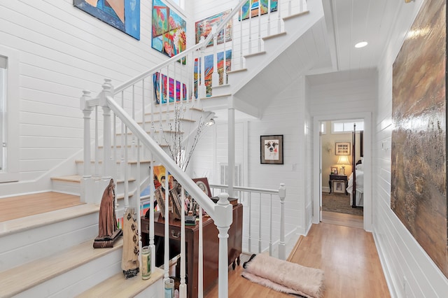 stairway with wood finished floors