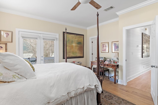 bedroom with visible vents, light wood-style floors, access to exterior, french doors, and crown molding