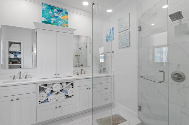 bathroom featuring a stall shower, a sink, and double vanity