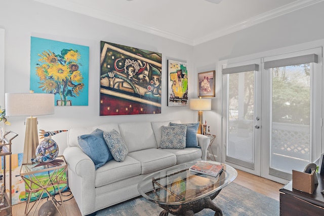 living area featuring ornamental molding, wood finished floors, and french doors