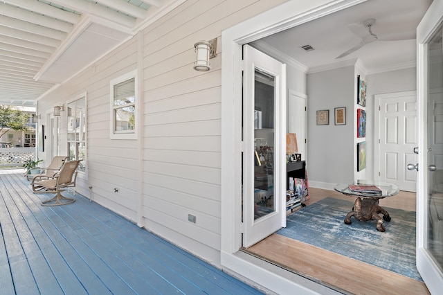 deck with a porch and visible vents