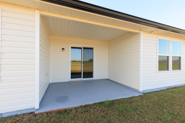 entrance to property with a patio