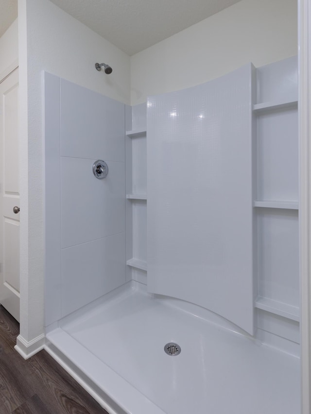 bathroom featuring walk in shower