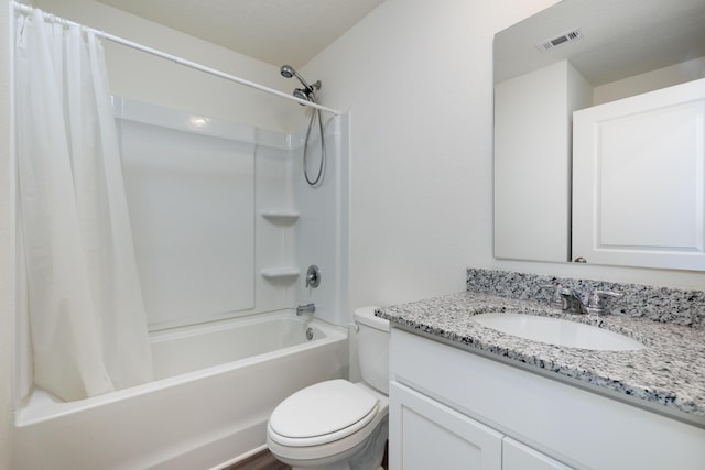 full bathroom featuring toilet, shower / bath combination with curtain, vanity, and visible vents