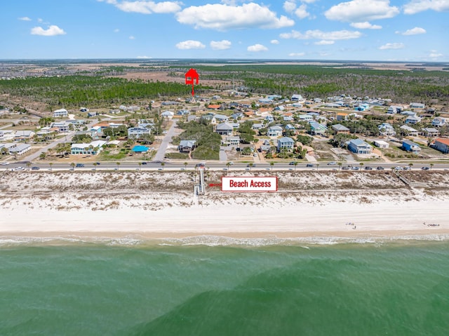 aerial view with a water view, a residential view, and a view of the beach