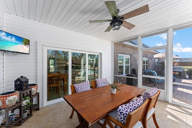 sunroom / solarium with wooden ceiling and a ceiling fan