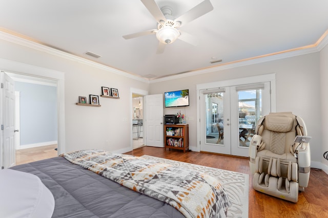 bedroom featuring wood finished floors, visible vents, access to exterior, french doors, and crown molding