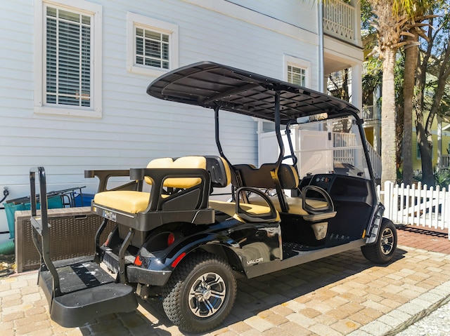 exterior space with a carport and fence