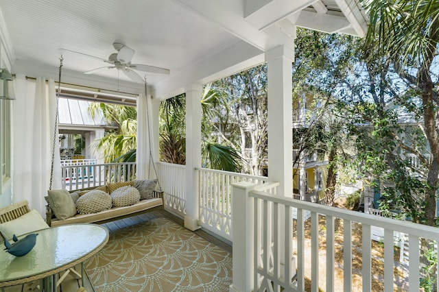 sunroom featuring ceiling fan