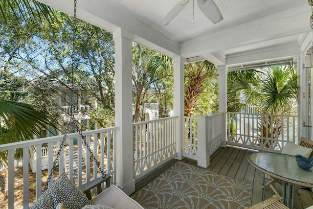 sunroom / solarium featuring ceiling fan