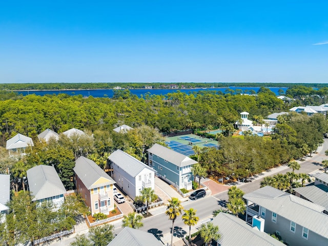 bird's eye view with a view of trees and a water view