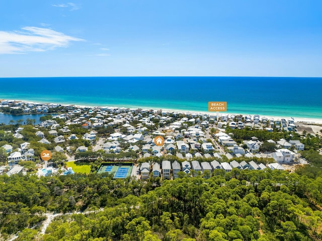 birds eye view of property featuring a view of the beach and a water view