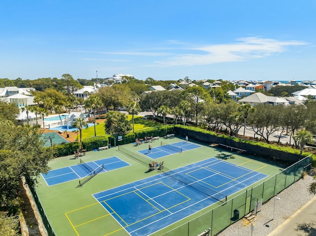 view of sport court with fence