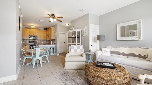 20 N Wildflower Dr Unit 512, Santa Rosa Beach, FL 32459 - living room with light tile patterned floors, visible vents, baseboards, and a ceiling fan
