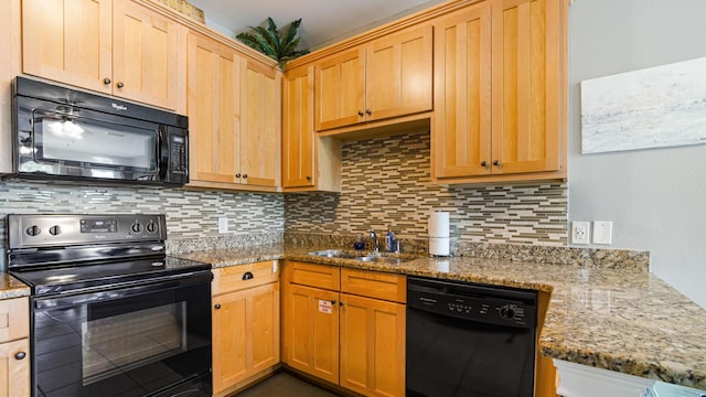20 N Wildflower Dr Unit 512, Santa Rosa Beach, FL 32459 - kitchen featuring black appliances, light stone counters, tasteful backsplash, and a sink