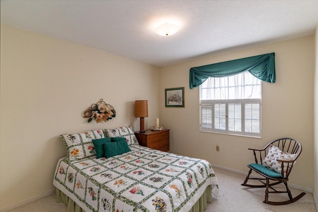 carpeted bedroom with baseboards