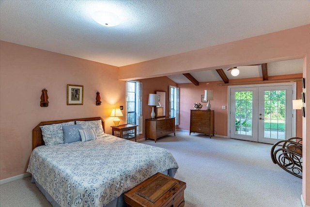 bedroom with access to exterior, french doors, light carpet, and beamed ceiling