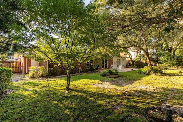 view of yard with a patio and fence