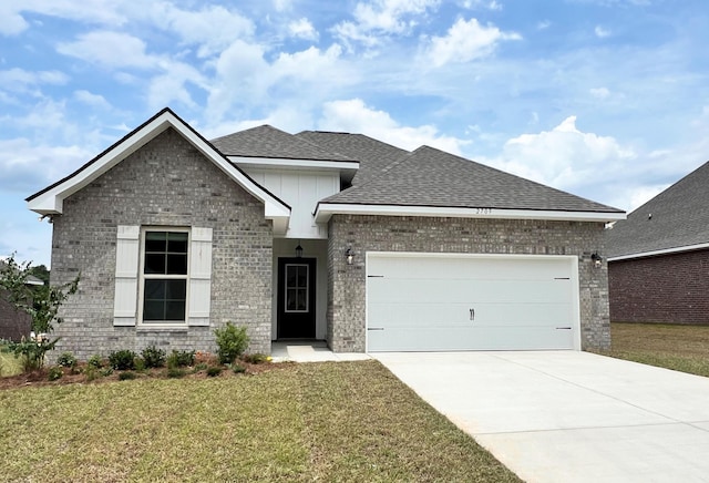 2709 Louis Cir, Crestview, FL 32536 - view of front facade featuring brick siding, a garage, a front yard, roof with shingles, and concrete driveway