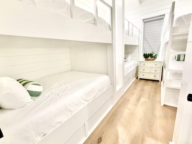 bedroom with light wood finished floors