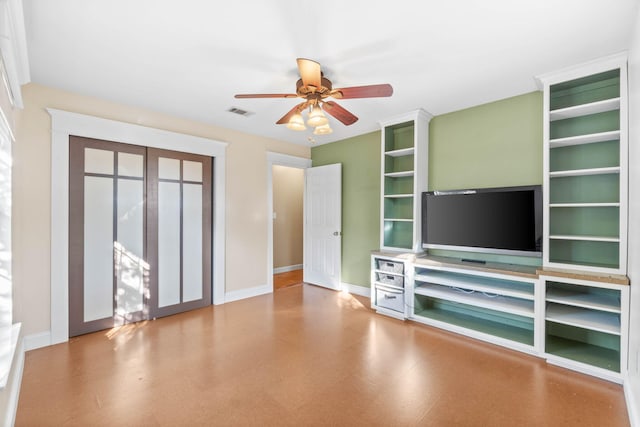 unfurnished living room with visible vents, ceiling fan, and baseboards