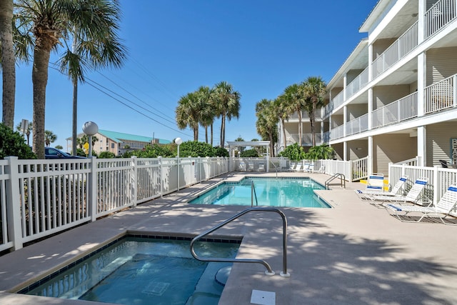 pool featuring a patio area and fence