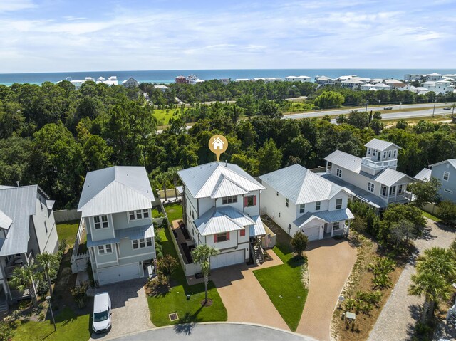 bird's eye view featuring a water view and a residential view