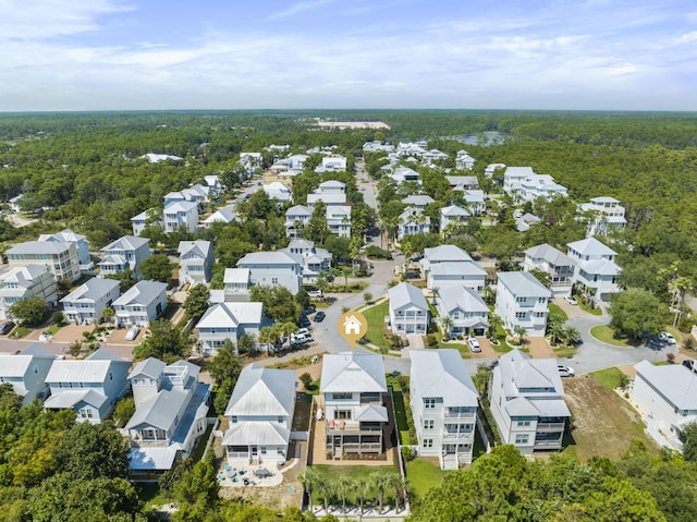 bird's eye view featuring a view of trees and a residential view