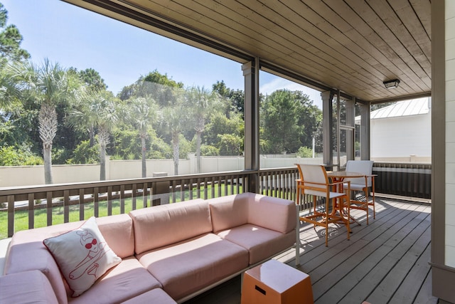 wooden terrace featuring fence and an outdoor hangout area