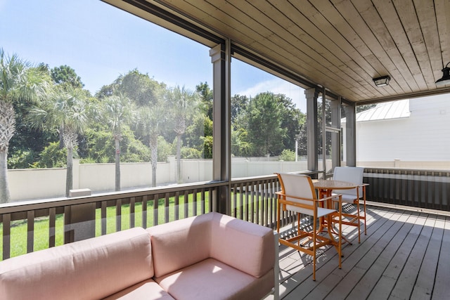 sunroom featuring wood ceiling