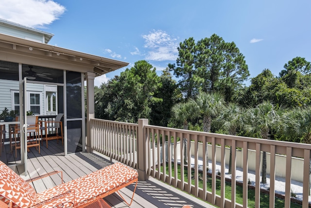 wooden terrace featuring a sunroom