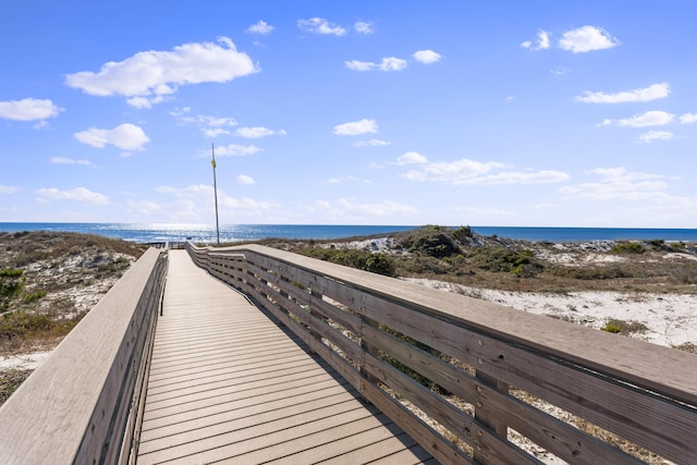 view of property's community featuring a water view and a view of the beach