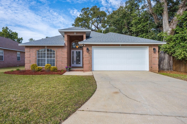 ranch-style home with a shingled roof, a front lawn, concrete driveway, a garage, and brick siding