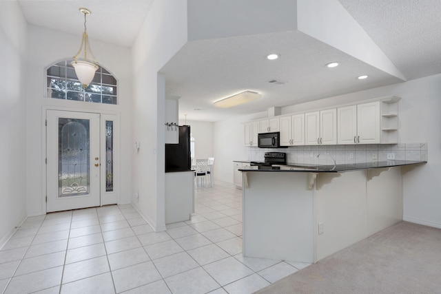 kitchen with open shelves, dark countertops, backsplash, and black appliances