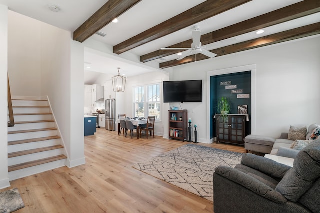 living room with stairway, baseboards, beam ceiling, recessed lighting, and light wood-style floors