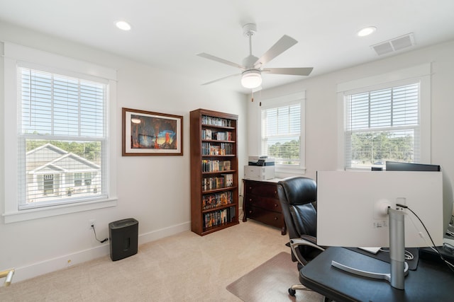 office area with baseboards, visible vents, recessed lighting, ceiling fan, and light carpet