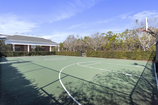 view of basketball court featuring community basketball court and fence