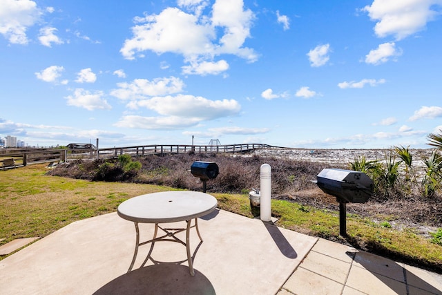 view of patio featuring fence