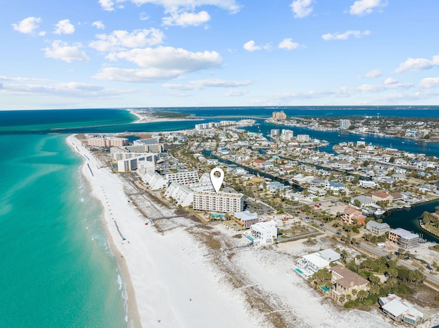 aerial view featuring a view of city, a beach view, and a water view