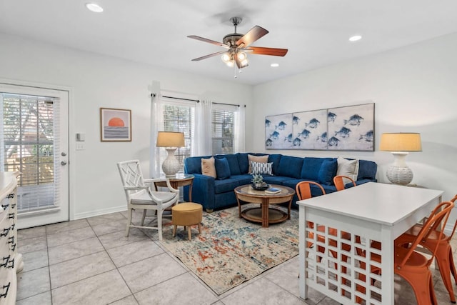 living area with a ceiling fan, recessed lighting, baseboards, and light tile patterned floors