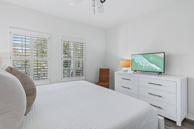 bedroom with ceiling fan and wood finished floors