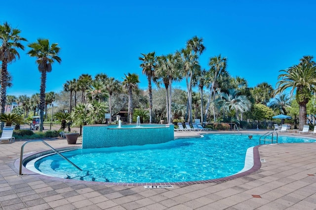 pool featuring a patio and fence