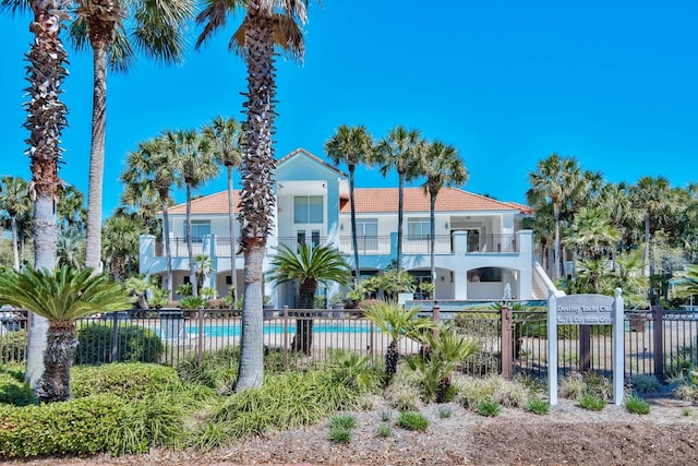 exterior space with fence and a fenced in pool