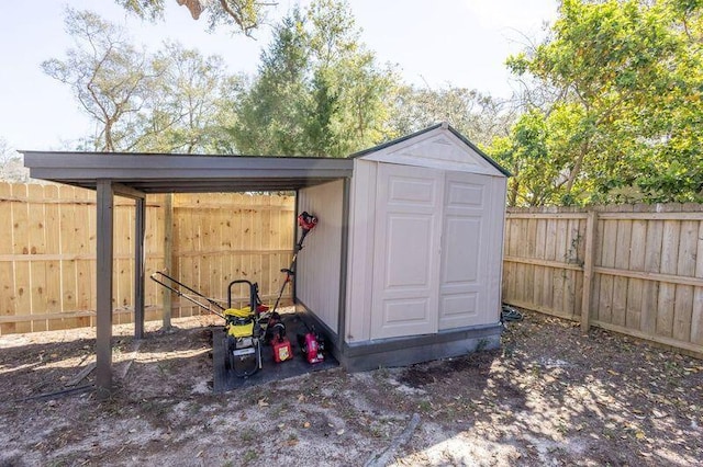 view of shed with a fenced backyard